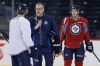 John Woods / The Canadian Press
New head coach Paul Maurice talks with Bryan Little during his first practice.