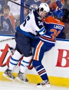 Jason Franson / Canadian Press archives
Adam Lowry (#56) is heading to the St. John's IceCaps.