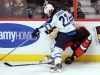Sean Kilpatrick / The Canadian Press
The Jets' Chris Thorburn sends Ottawa's Mark Borowiecki into the boards during first period action.