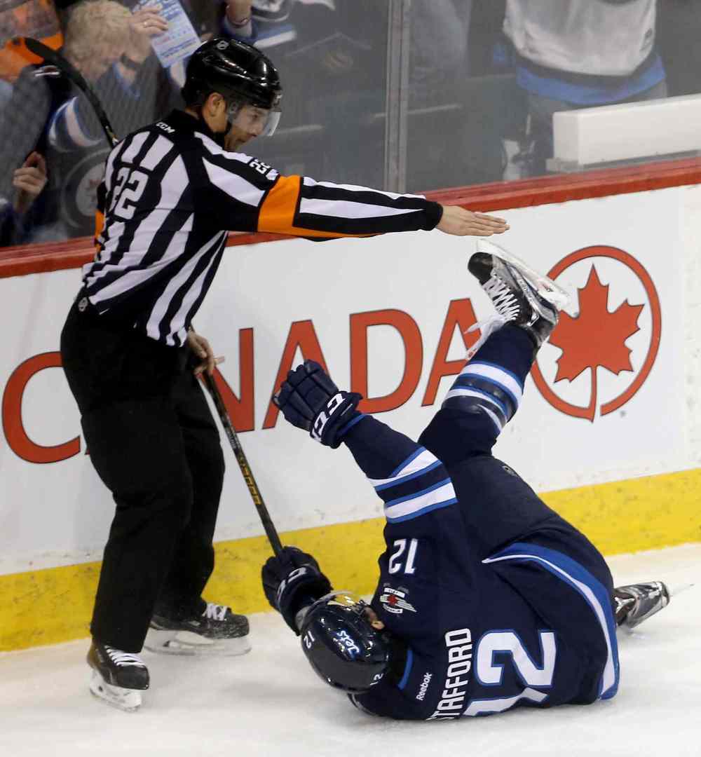 Trevor Hagan / The Canadian Press
Winnipeg Jets' Drew Stafford (12) celebrates after scoring on Nashville Predators goaltender Pekka Rinne during the first period.