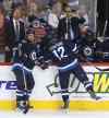 THE CANADIAN PRESS/Trevor Hagan
Winnipeg Jets' head coach Paul Maurice, second from right, signals at a referee during the third period while playing the Ottawa Senators during pre-season NHL hockey action in Winnipeg on Tuesday.