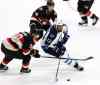 THE CANADIAN PRESS/Fred Chartrand
Winnipeg Jets' Dustin Byfuglien (33) fights for control of the puck with Ottawa Senators' Alex Chiasson (90) and Jean-Gabriel Pageau (44) on Thursday.