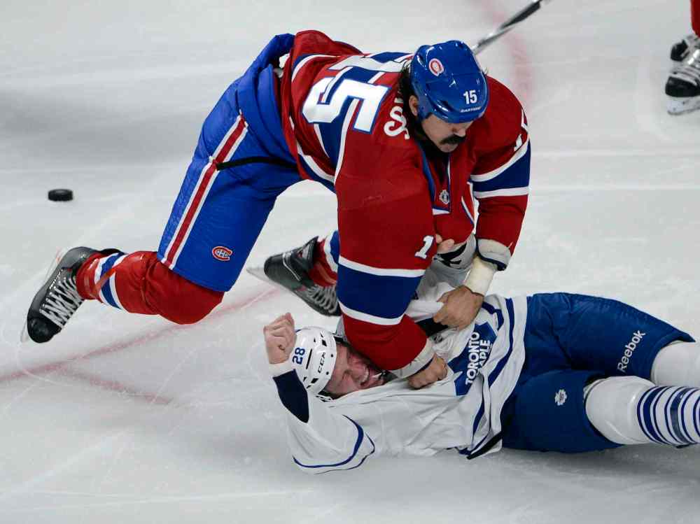 Ryan Remiorz / THE CANADIAN PRESS ARCHIVES
The Canadiens' George Parros and the Maple Leafs' Colton Orr (28) fight in Montreal Tuesday.