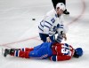 Ryan Remiorz / The Canadian Press
Leafs winger Colton Orr kneels over Montreal Canadiens winger George Parros after he hit his head on the ice during their fight last night.