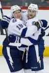 John Woods / The Canadian Press
Tampa Bay's Ondrej Palat (18) and Steven Stamkos celebrate Palat's overtime winner Friday night.