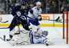 THE CANADIAN PRESS/John Woods
Tampa Bay Lightning goaltender Ben Bishop (30) saves the shot as Winnipeg Jets' Adam Lowry (17) looks for the rebound as Tampa Bay's Anton Stralman (6) defends during second period NHL action in Winnipeg.