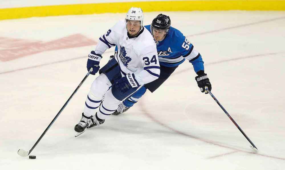 Auston Matthews (left) was kept off the scoresheet, but Mark Scheifele (right) notched a goal. (Trevor Hagan / The Canadian Press)