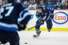 JOHN WOODS / THE CANADIAN PRESS
Winnipeg Jets' Mark Scheifele (55) makes the pass to Nikolaj Ehlers (27) who shoots for the tying goal during second period NHL action against the Tampa Bay Lightning, in Winnipeg on Sunday, Dec. 16, 2018.