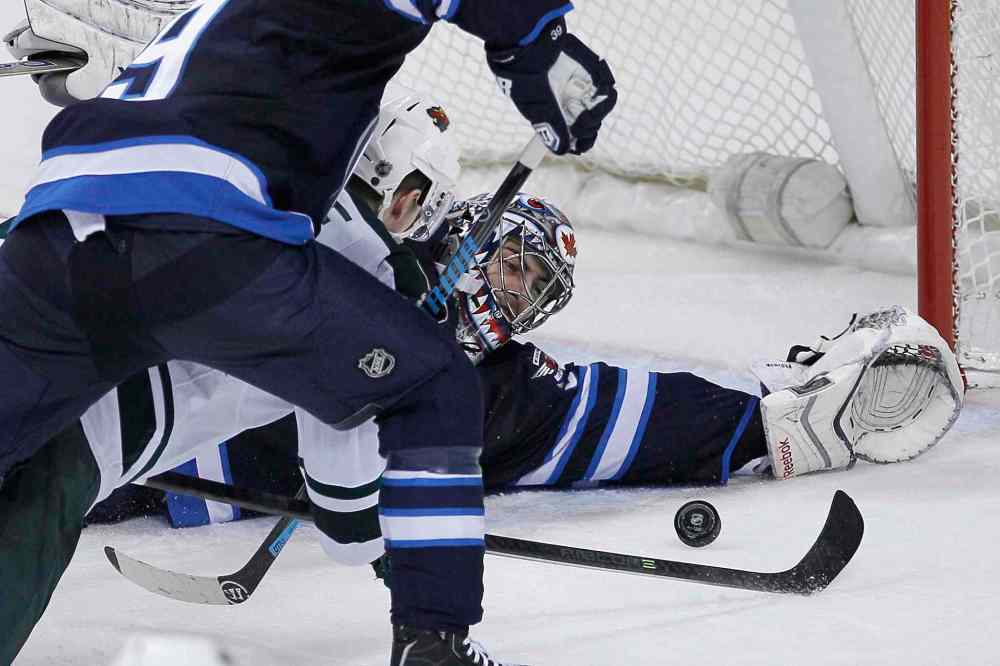 John Woods / The Canadian Press
Winnipeg Jets' goaltender Al Montoya stretches to stop a shot from Minnesota Wild's Charlie Coyle Friday at the MTS Centre. He will get the start Sunday in Denver when the Jets face off against the Colorado Avalanche.