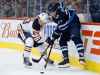 THE CANADIAN PRESS/John Woods
Edmonton Oilers' Matthew Benning and Winnipeg Jets' Nikolaj Ehlers fight for possession of the puck during the second period, Wednesday.