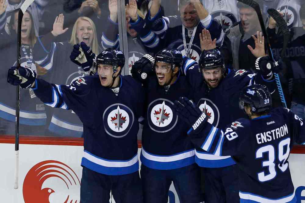 John Woods / THE CANADIAN PRESS FILES
Winnipeg Jets Mark Scheifele, Evander Kane, Zach Bogosian and Toby Enstrom (from left) celebrate one of the team's scarce goals.