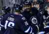 John Woods / THE CANADIAN PRESS FILES
Right-winger Dustin Byfuglien was all smiles Tuesday as he celebrated his highlight-reel goal against Carolina with teammates Bryan Little, Andrew Ladd and Jacob Trouba.