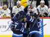 Winnipeg Jets' Ben Chiarot (7), Nikolaj Ehlers (27) and Mark Stuart (5) celebrate Ehlers' goal against the Nashville Predators during third period NHL action in Winnipeg on Thursday, January 14, 2016. (THE CANADIAN PRESS/John Woods)