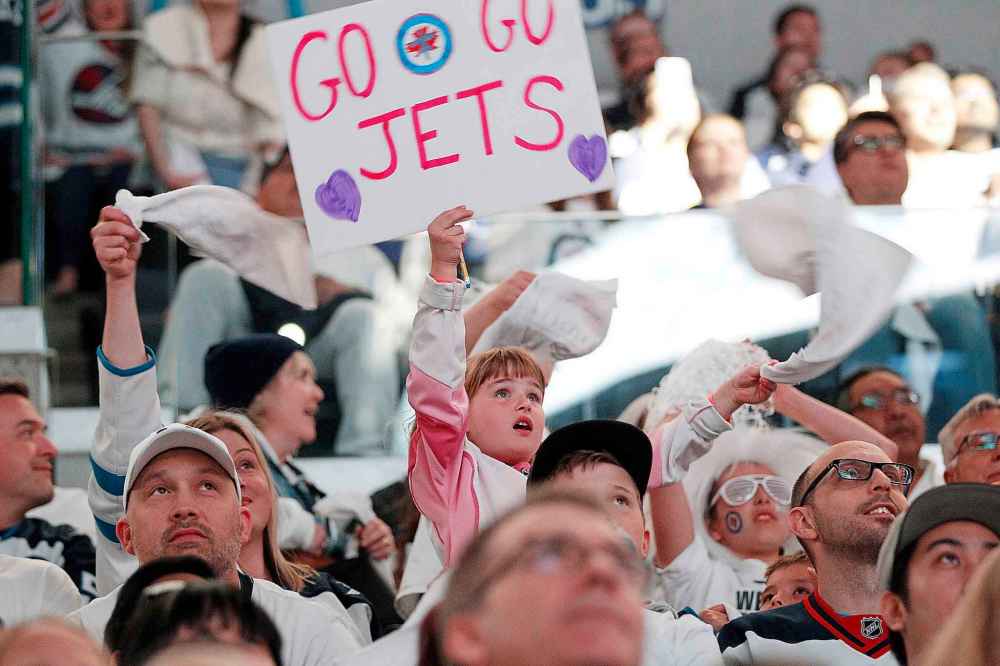 JOHN WOODS / THE CANADIAN PRESS FILES
Winnipeg Jets fans react during a viewing party of NHL playoff action between the Jets and Nashville Predators in Winnipeg in May.