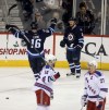 Trevor Hagan / The Canadian Press
Winnipeg Jets' Andrew Ladd (16) and Bryan Little (18) celebrate after Little opened the scoring against the New York Rangers' during first period NHL hockey action in Winnipeg, Friday night.