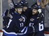 JOHN WOODS / The Canadian Press
Winnipeg Jets' Adam Lowry (17), Tyler Myers (57) and Michael Frolik (67) celebrate Frolik's goal against the Ottawa Senators during the third period.