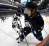 Trevor Hagan / The Canadian Press
Winnipeg Jets' Alexander Burmistrov, right, plays the puck in front of Minnesota Wild's Maxime Fortunus during second period NHL hockey action in Winnipeg, Tuesday, Sept. 22, 2015.