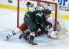 Joel Eriksson Ek bangs the puck in past Dmitry Kulikov and Connor Hellebuyck to give the Wild a 3-2 lead with just over one minute left in the game. (Trevor Hagan / The Canadian Press)