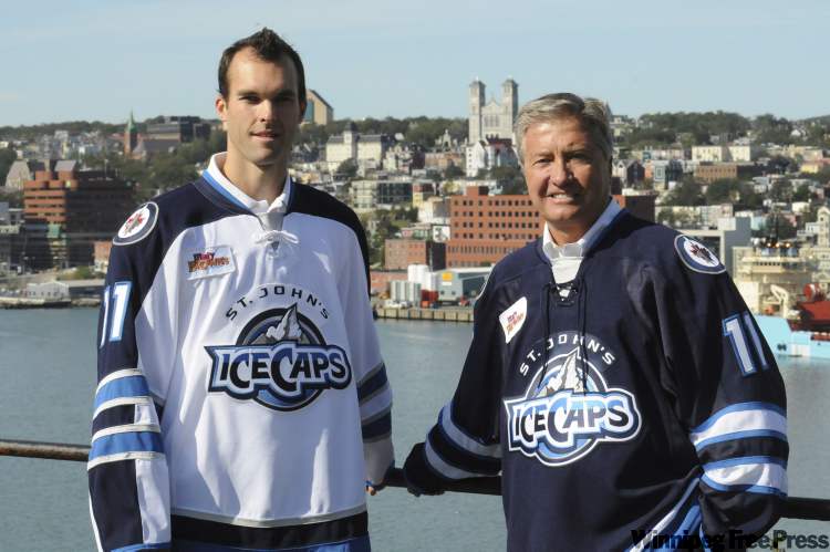 joe gibbons / the canadian press archives
IceCaps president Danny Williams (left) and right-winger Jason King debut the team's jerseys. The parent-club Jets play the Senators today in St. John's.
