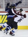 John Woods / WINNIPEG FREE PRESS
Big Buff sends Colorado's Jan Hejda flying during first-period action in Winnipeg on Sunday.