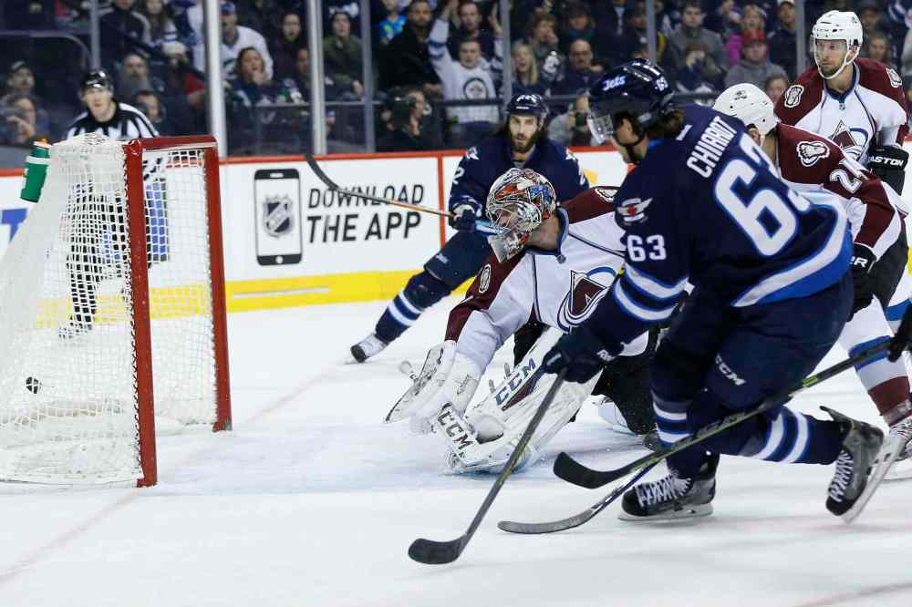 JOHN WOODS / WINNIPEG FREE PRESS
Winnipeg Jets defenceman Ben Chiarot (63) drives the puck past Colorado Avalanche goaltender Semyon Varlamov during second-period action Sunday night.