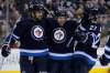 JOHN WOODS / WINNIPEG FREE PRESS
Jet Aaron Gagnon (centre), celebrates his second-period goal -- his first NHL marker -- with Dustin Byfuglien (left) and Eric Tangradi.