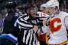 JOHN WOODS / WINNIPEG FREE PRESS
A linesman steps between Jets' Dustin Byfuglien and Flames' Ladislav Smid (front, right) and Chris Butler as tempers flare after the second-period buzzer at the MTS Centre Monday night.