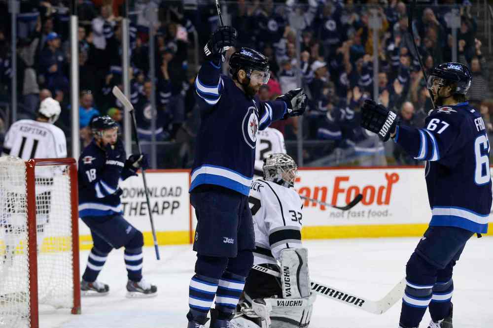 JOHN WOODS / WINNIPEG FREE PRESS
Winnipeg Jets' Andrew Ladd, Bryan Little and Michael Frolik celebrate Ladd's goal against Los Angeles Kings goaltender Jonathan Quick during the second period on Sunday.