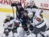 JOHN WOODS / WINNIPEG FREE PRESS
Winnipeg Jets' Eric Tangradi (27) and Olli Jokinen (12) fight for position with Minnesota Wild's Jared Spurgeon (46) and Mikko Koivu (9) in front of  goaltender Ilya Bryzgalov (30) during third period NHL action in Winnipeg on Monday.
