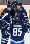 (John Woods / WINNIPEG FREE PRESS
Winnipeg Jets' Drew Stafford (12), Bryan Little (18), Andrew Ladd (16) and Mathieu Perreault (85) celebrate Stafford's goal against the Dallas Stars.