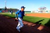 Iowa Cubs shortstop Addison Russell runs on the field before a Triple-A baseball game against the Nashville Sounds, Wednesday, April 24, 2019, in Des Moines, Iowa. Russell played in his first game of the season Wednesday for Iowa as he prepares to return to the Chicago Cubs following his domestic violence suspension. (AP Photo/Charlie Neibergall)