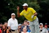 Tiger Woods catches the ball from his caddie, Joe LaCava on the 12th hole during the third round of the BMW Championship golf tournament at Medinah Country Club, Saturday, Aug. 17, 2019, in Medinah, Ill. (AP Photo/Nam Y. Huh)