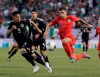 United States midfielder Christian Pulisic, right, controls the ball against Mexico defender Carlos Salcedo during the first half of the CONCACAF Gold Cup final soccer match at Soldier Field in Chicago, Sunday, July 7, 2019. (AP Photo/Nam Y. Huh)