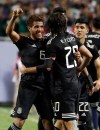 Mexico midfielder Jonathan Dos Santos (6) celebrates with forward Rodolfo Pizarro (20) after scoring his first goal against the United States during the second half of the CONCACAF Gold Cup final soccer match in Chicago, Sunday, July 7, 2019. (AP Photo/Nam Y. Huh)