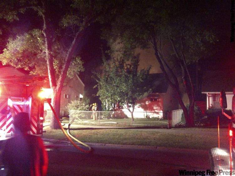 Trevor Hagan/ Winnipeg Free Press
Firefighters battle fire early Tuesday.