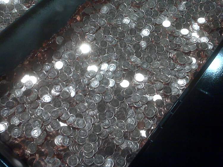 Ken Gigliotti / Winnipeg Free Press
The last pennies to be minted  roll along at the Mint on Friday morning.