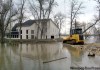 MIKE DEAL / WINNIPEG FREE PRESS
A road is rebuilt today after the previous access road was washed away at this house on Turnbull Drive.