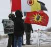 Wayne Glowacki / Winnipeg Free Press
Protesters on the CN rail tracks that cross the Yellowhead Highway west of Portage la Prairie last week. CN Rail police were on the scene to alert the conductor, and the westbound train stopped about a kilometre away from the protesters.