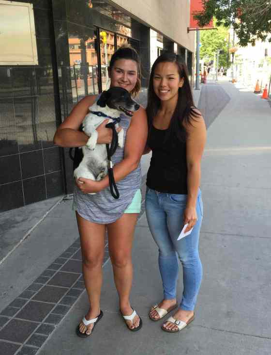 Taylor Funk (l) of Roblin holding Duke, her 10-year-old Jack Russell terrier who was found in Winnipeg by Melissa Chung (r). Chung posted about Duke on Winnipeg Lost Dog Alert's Facebook page and Funk was able to be reunited with her dog after over a month and 400 kilometres away. SUPPLIED PHOTO