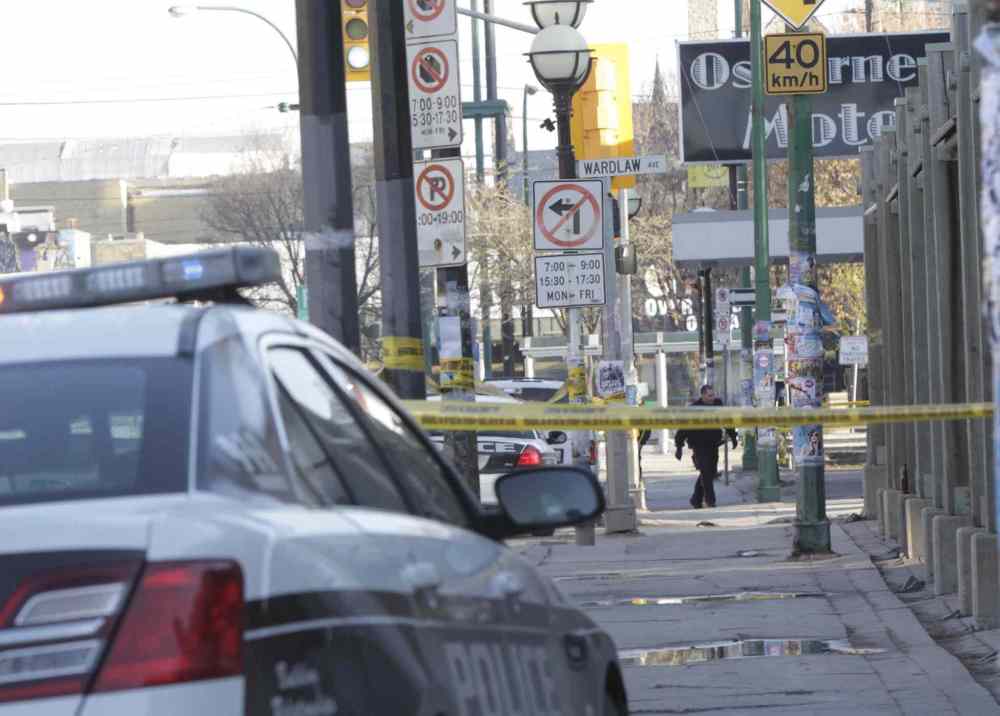 Wayne Glowacki / Winnipeg Free Press
Police at a taped-off scene in Osborne Village Thursday morning.