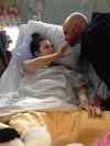 Winnipeg Free Press Files
Calli Vanderaa visits with her dad, Corey, during  a three-week stay in hospital after being shot.