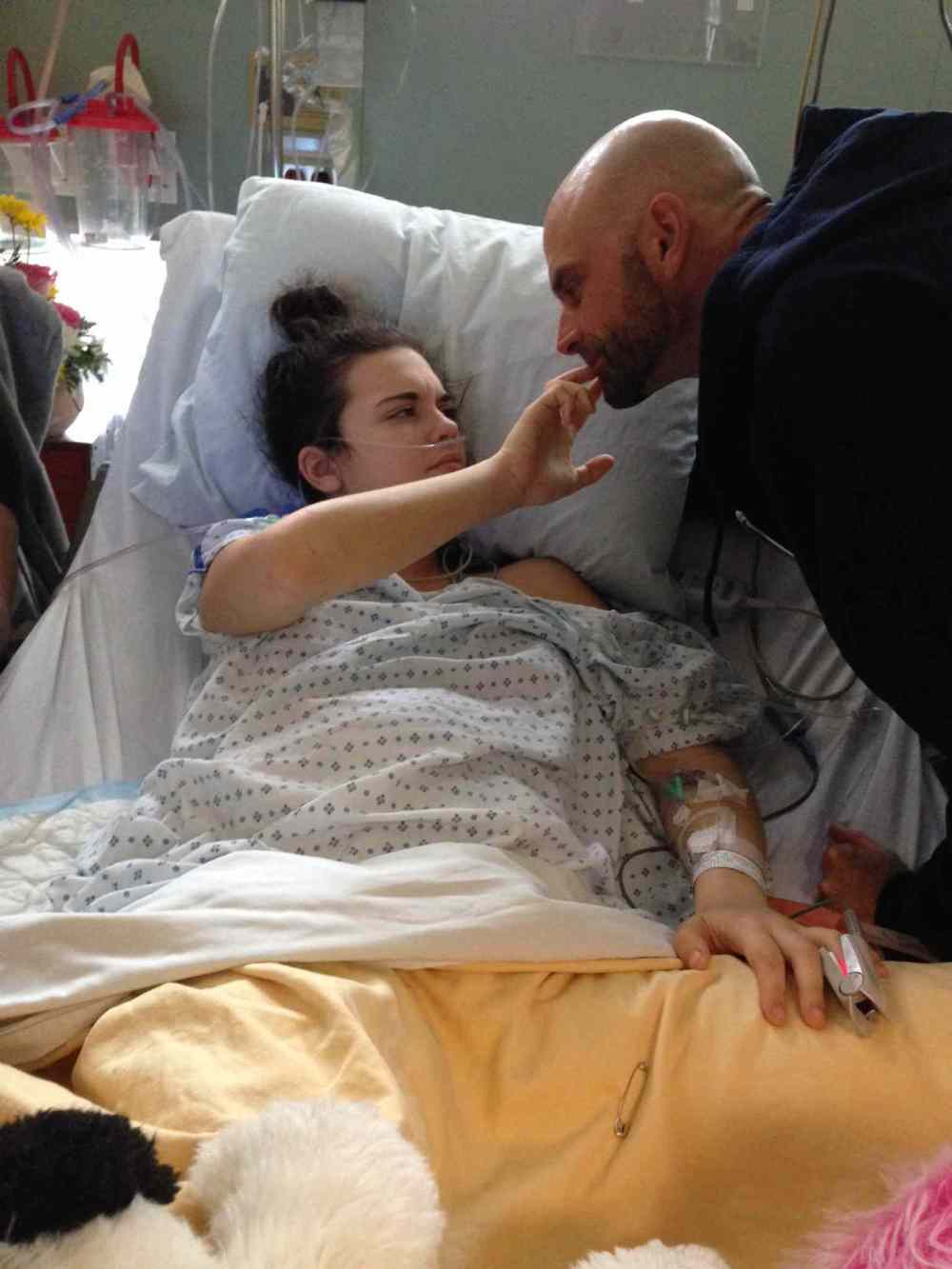 Winnipeg Free Press Files
Calli Vanderaa visits with her dad, Corey, during a three-week stay in hospital after being shot.
