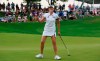 Mi Jung Hur acknowledges the crowd on the eighteenth green during the final round of the Indy Women in Tech Championship golf tournament, Sunday, Sept. 29, 2019, in Indianapolis. (AP Photo/R Brent Smith)