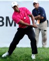 Tiger Woods makes a chip shot on the ninth hole during the third round of the BMW Championship PGA golf tournament at Crooked Stick Golf Club in Carmel, Ind., Saturday, Sept. 8, 2012. (AP Photo/Charles Rex Arbogast)