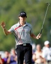 Rory McIlroy, of Northern Ireland, reacts after his birdie on the 16th hole during the BMW Championship PGA golf tournament at Crooked Stick Golf Club in Carmel, Ind., Sunday, Sept. 9, 2012. McIlroy won the event. (AP Photo/Charles Rex Arbogast)