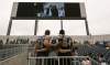 Melissa Tait / Winnipeg Free Press archives
Blue Bombers players Chris Kowalczuk and Chris Greaves pose for a photo with a fan at the first event held at Investors Group Field. About 15,000 people attended One Heart Winnipeg Sunday afternoon.