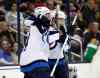 Paul Vernon / The Associated Press
Winnipeg Jets' Andrew Copp, right, celebrates with teammate Anthony Peluso after scoring a goal against the Columbus Blue Jackets during the first period of an NHL hockey game in Columbus, Ohio, Saturday.