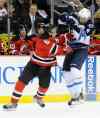 Bill Kostroun / the associated press
New Jersey Devils defenceman Andy Greene checks Winnipeg Jets forward Evander Kane during the first period of an NHL game in Newark, N.J., Monday.