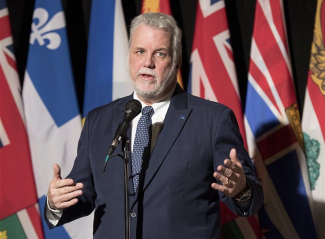 Quebec Premier Philippe Couillard speaks to reporters before a meeting with premiers hosted by the Council of The Federation in Ottawa on Monday, Nov. 23, 2015. THE CANADIAN PRESS/Justin Tang