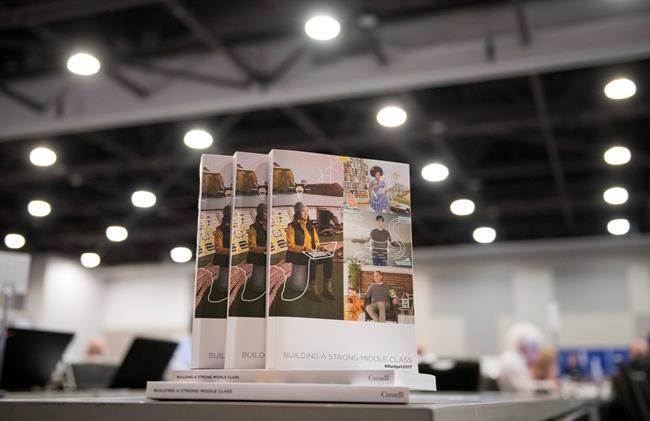 Copies of the federal budget are seen at the media lock-up, before being tabled by Minister of Finance Bill Morneau in the House of Commons on Parliament Hill, in Ottawa on Wednesday, March 22, 2017. THE CANADIAN PRESS/Justin Tang